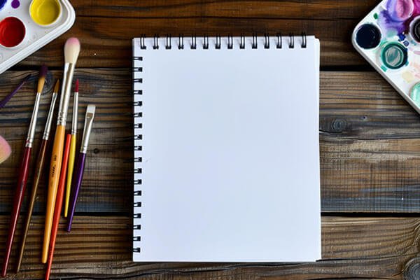 sketbook with paint and brushes